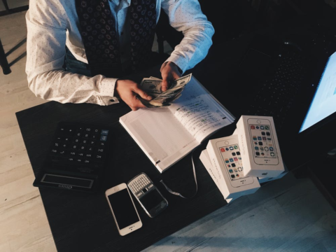 A tax accountant counting money saved in deductions